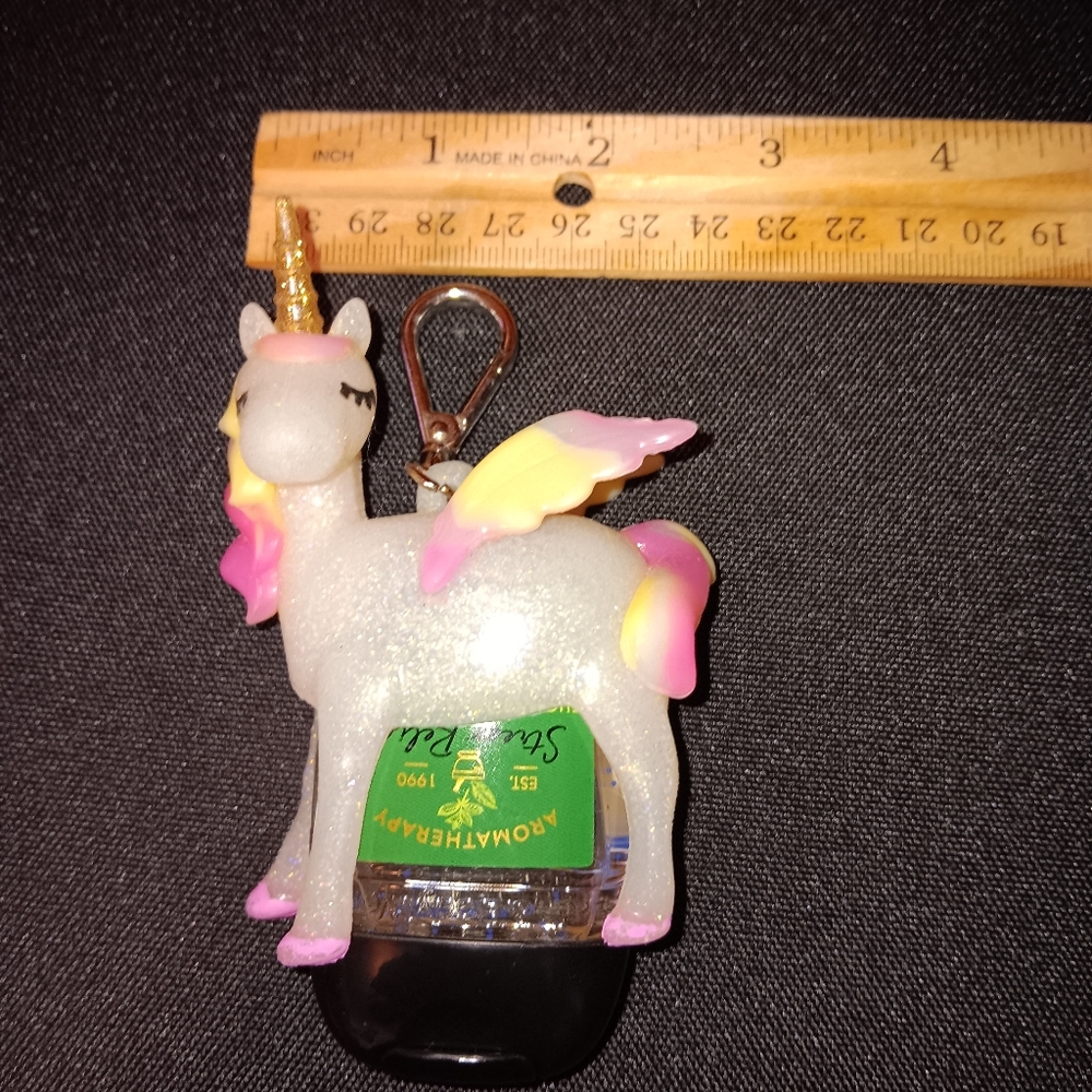 EUC BBW unicorn pocket bac holder with Eucalyptus spearmint hand sanitizer.